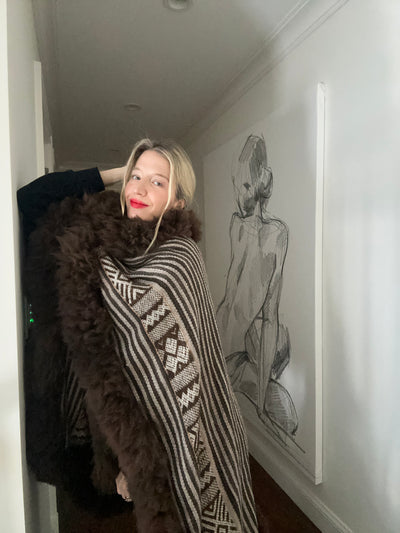 Video of baby alpaca wool cape, showcasing its heirloom quality and high quality craftsmanship.